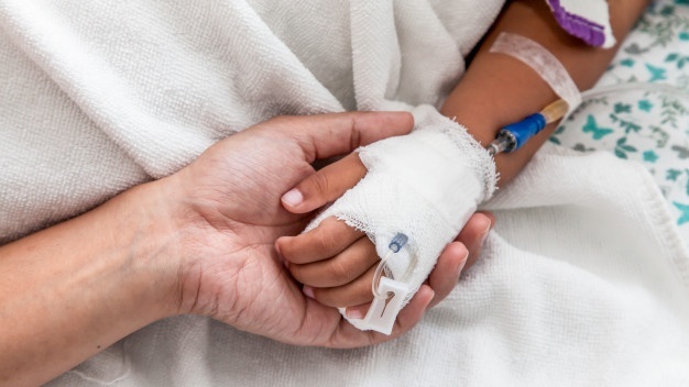 mother-holding-child-s-hand-who-have-iv-solution-in-the-hospital_7186-22-Cropped-1.jpg