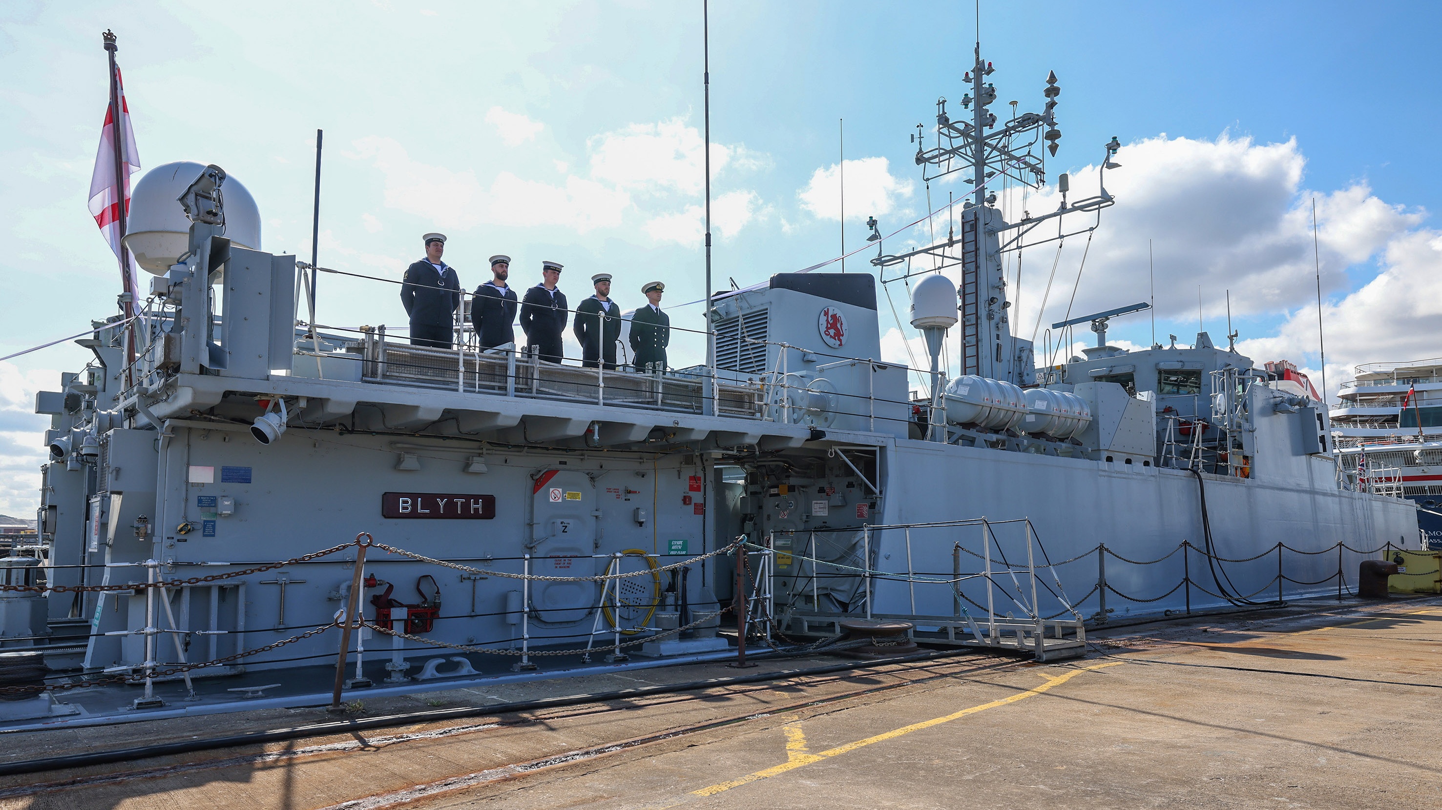 Five-sailors-stand-on-Blyths-upper-deck-for-the-ceremony-Cropped.jpg